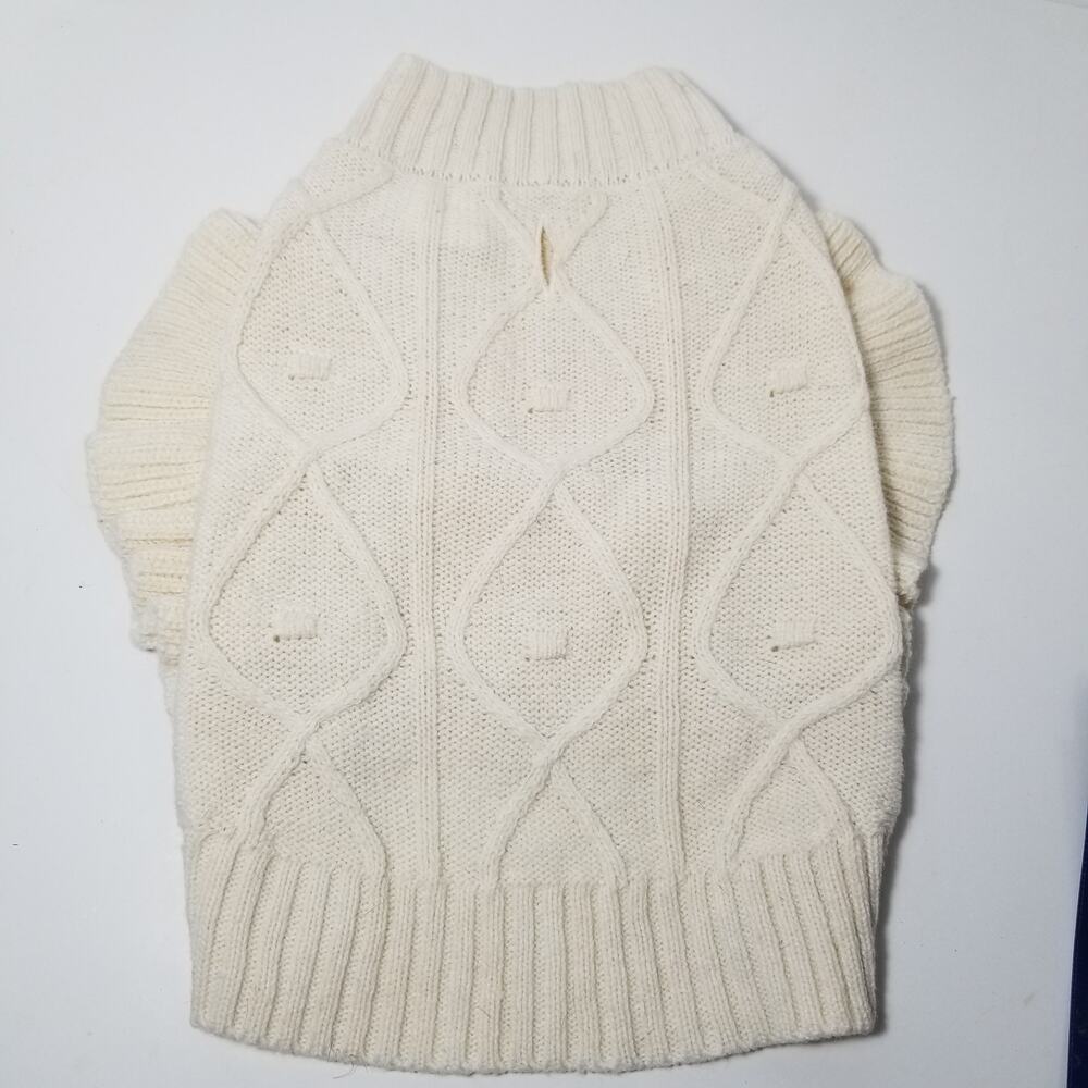 small girl doggie light sweater  one small faint stain on underside of sweater